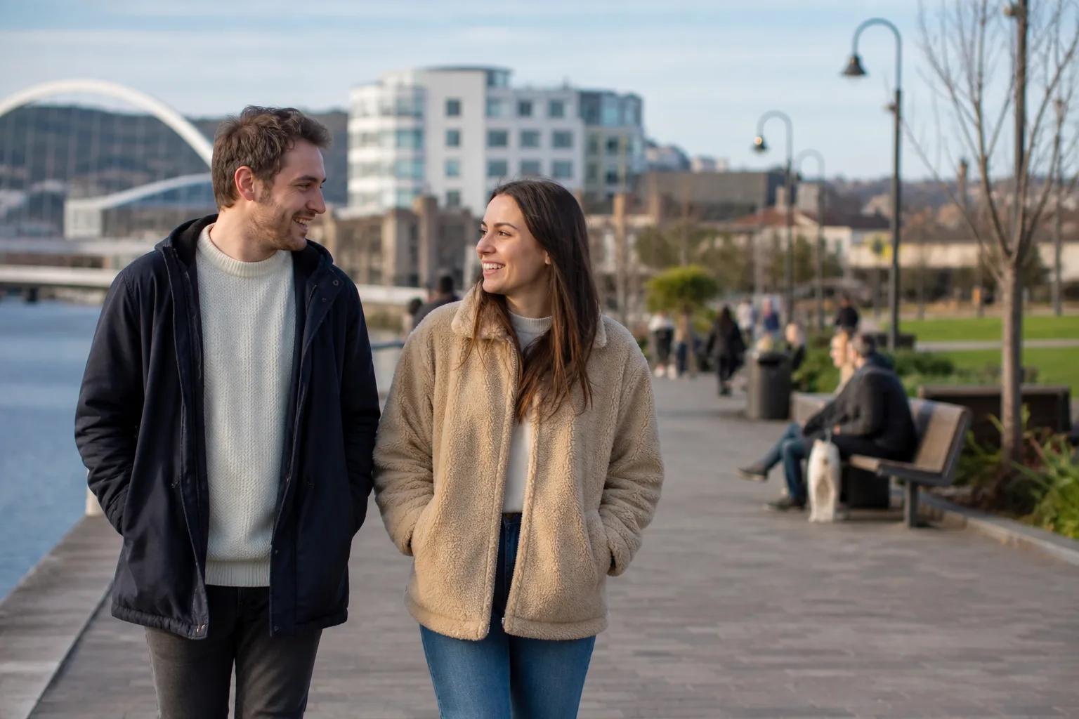 A couple walking beside the River Usk in Newport